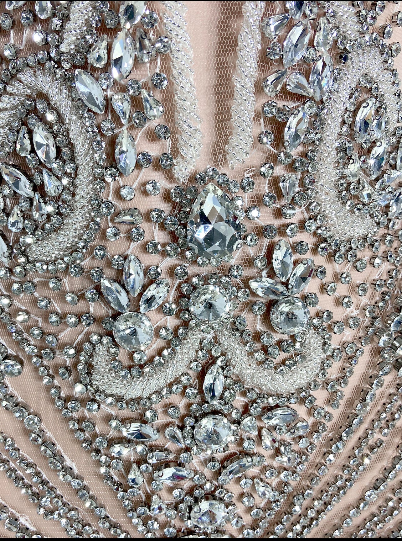 A glamorous silver sequin dress with all-over shimmering sequins and a figure-flattering silhouette, perfect for formal events and parties