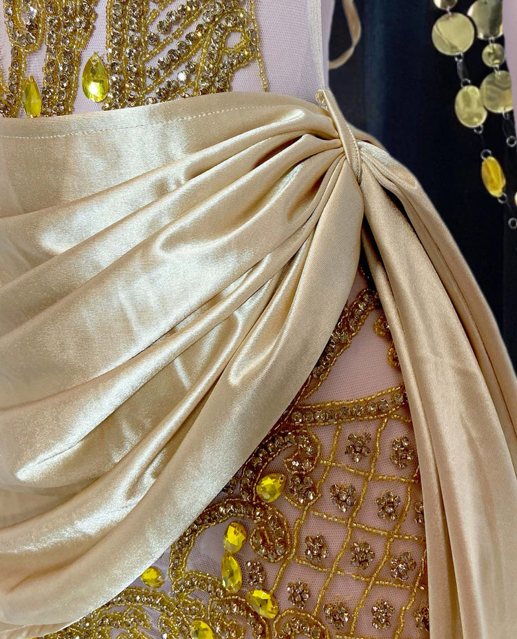 A trendy rhinestone denim mini dress featuring sparkling rhinestone straps, with a flattering fitted silhouette that combines edgy denim and glamorous accents. Perfect for both casual and evening wear