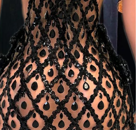 A stylish sequins mini dress embellished with rhinestone accents, perfect for a glamorous evening look.