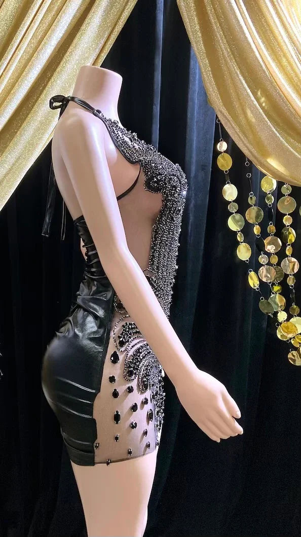 Appliqué mini dress with black rhinestones, featuring intricate detailing and perfect for parties or formal events