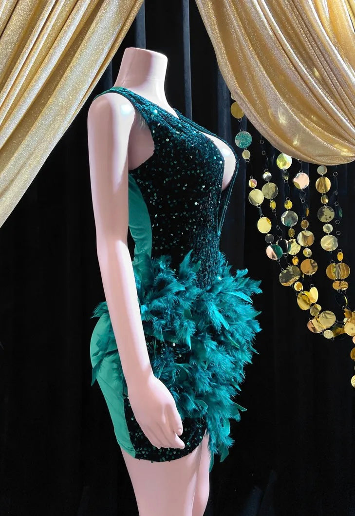 Dark green feather-embellished mini dress with rhinestone details, perfect for a birthday celebration or special event.