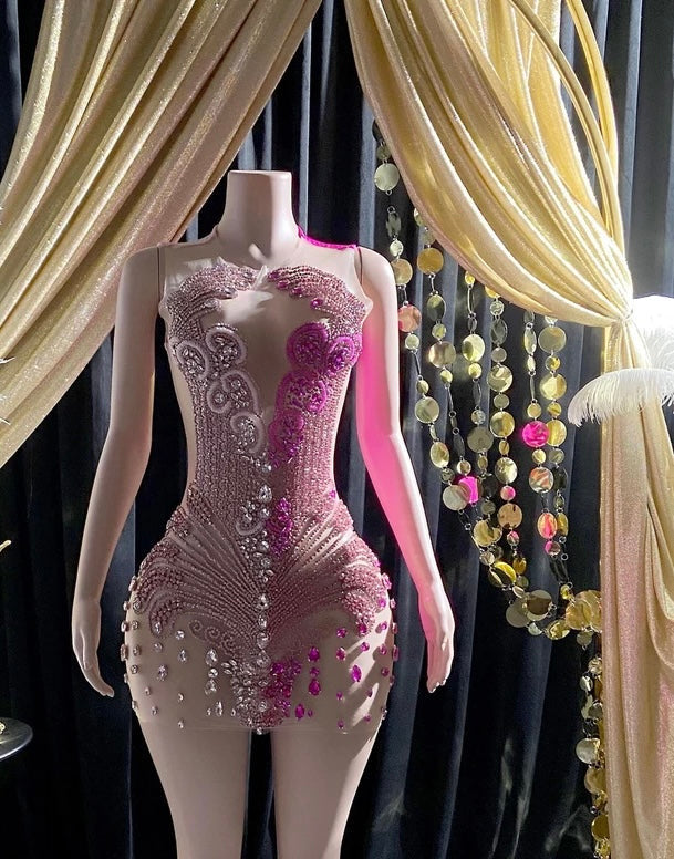 A collection of elegant rhinestone dresses and glamorous prom dresses featuring intricate embellishments.