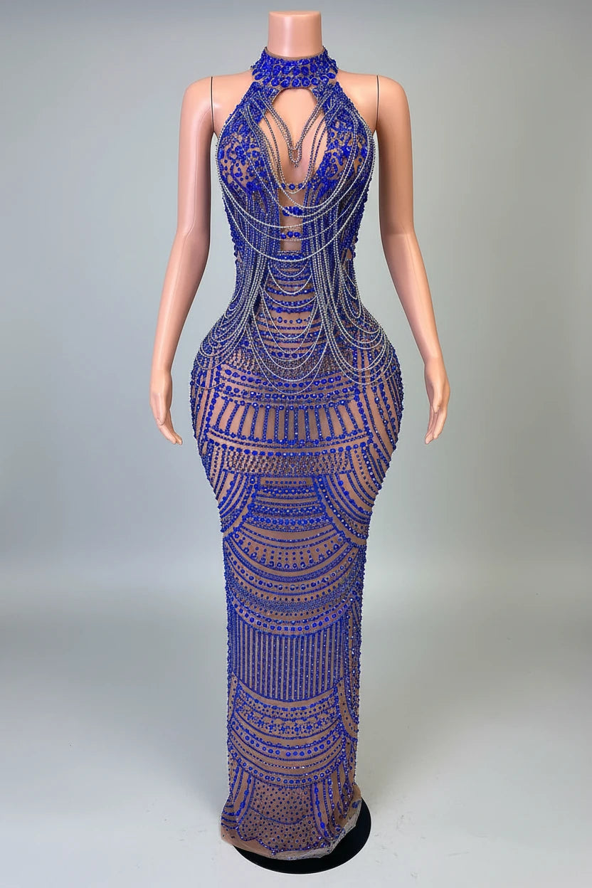 Mannequin wearing a blue beaded evening gown in a decorative room.