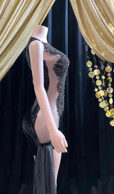 an elegant black midi cocktail dress, showcasing a sophisticated look perfect for formal occasions or cocktail parties