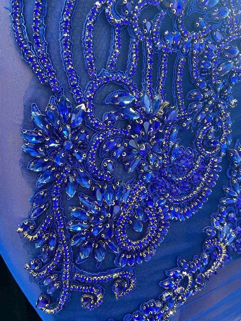 A stunning royal blue embellished mini dress with sparkling rhinestones, ideal for prom or formal events.