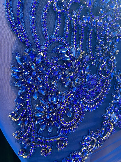 A stunning royal blue embellished mini dress with sparkling rhinestones, ideal for prom or formal events.