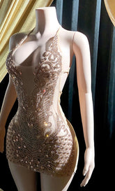 Front view of a gold rhinestone A-line mini dress with sparkling rhinestones and an elegant fit.