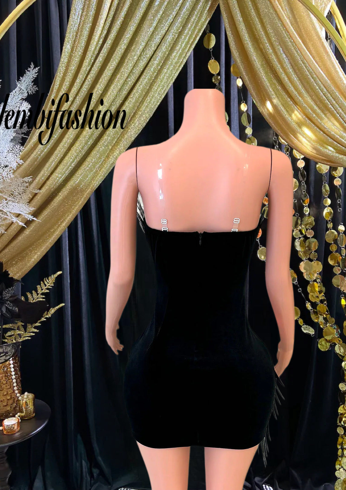 A mini dress with metallic feathers featuring a chic design and eye-catching accents for a bold, stylish look.