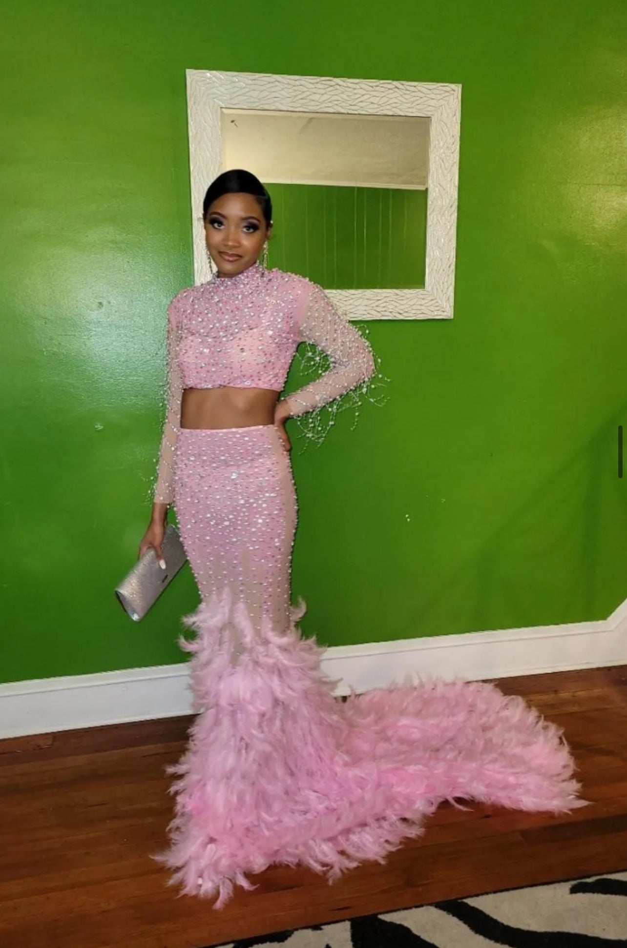 A stunning pink feather set cocktail dress with elegant feather detailing, perfect for formal events and parties.