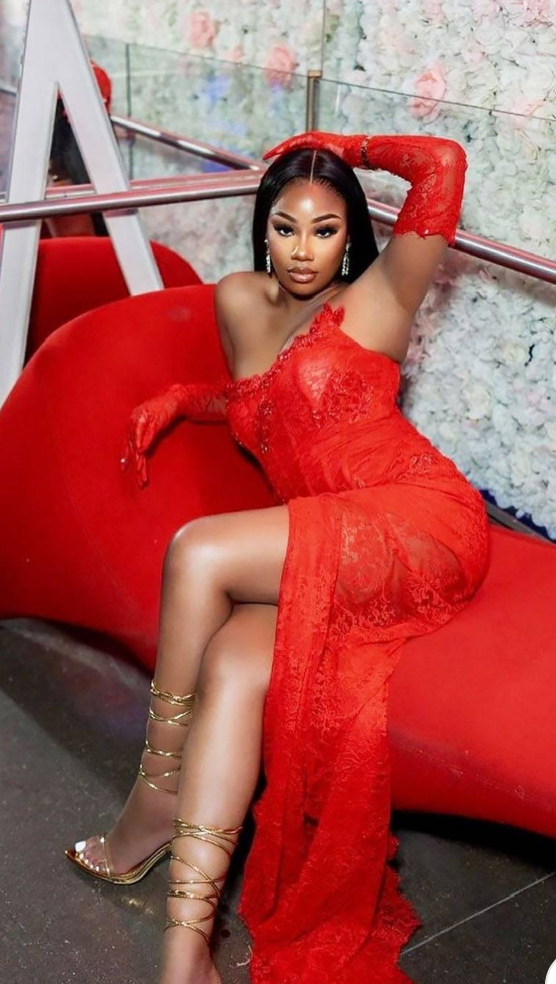 A glamorous red lace long dress with intricate details, designed as a versatile set dress for formal occasions.