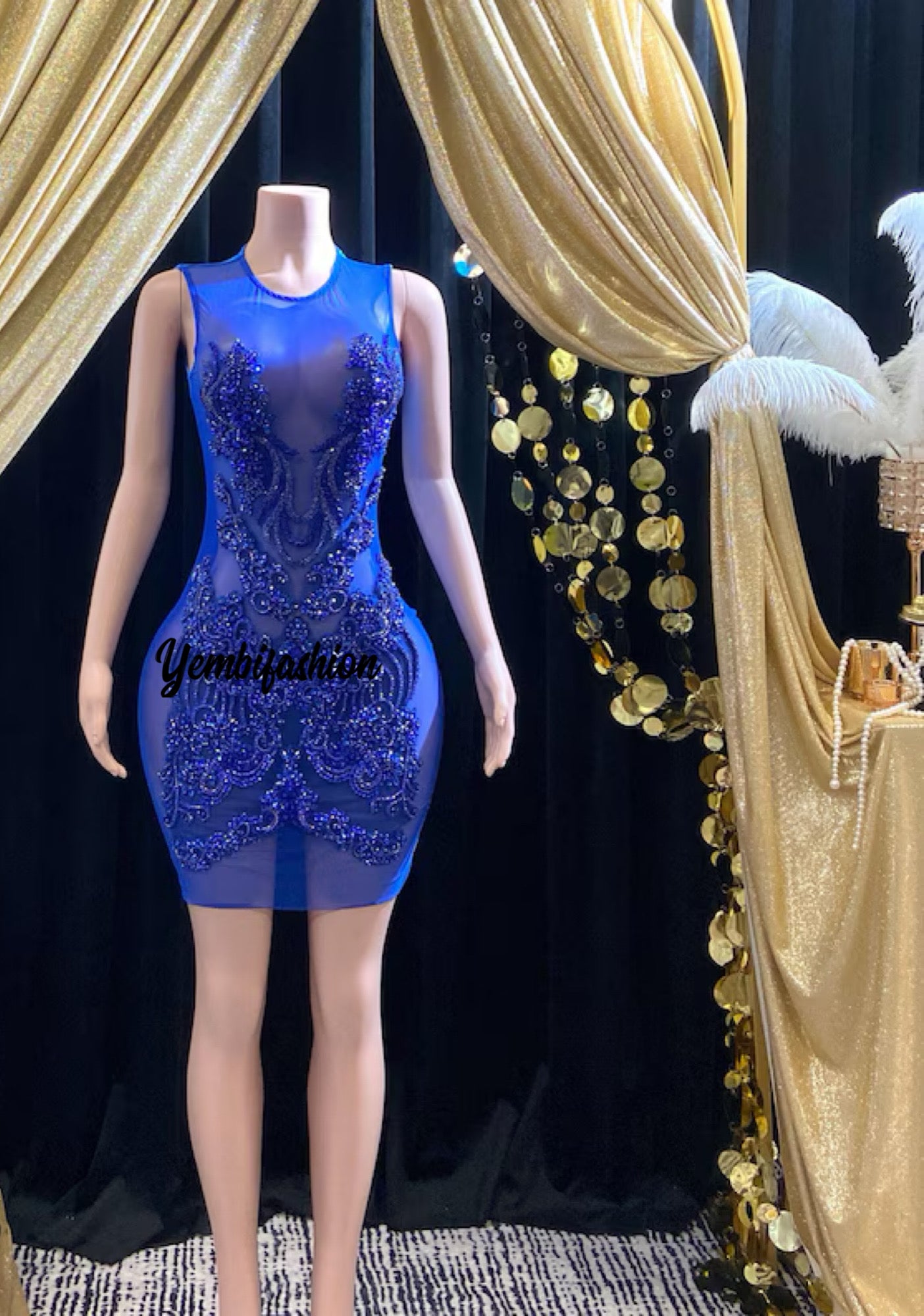 A stunning royal blue embellished mini dress with sparkling rhinestones, ideal for prom or formal events.