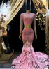 A stunning pink feather set cocktail dress with elegant feather detailing, perfect for formal events and parties.