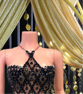 A stylish sequins mini dress embellished with rhinestone accents, perfect for a glamorous evening look.