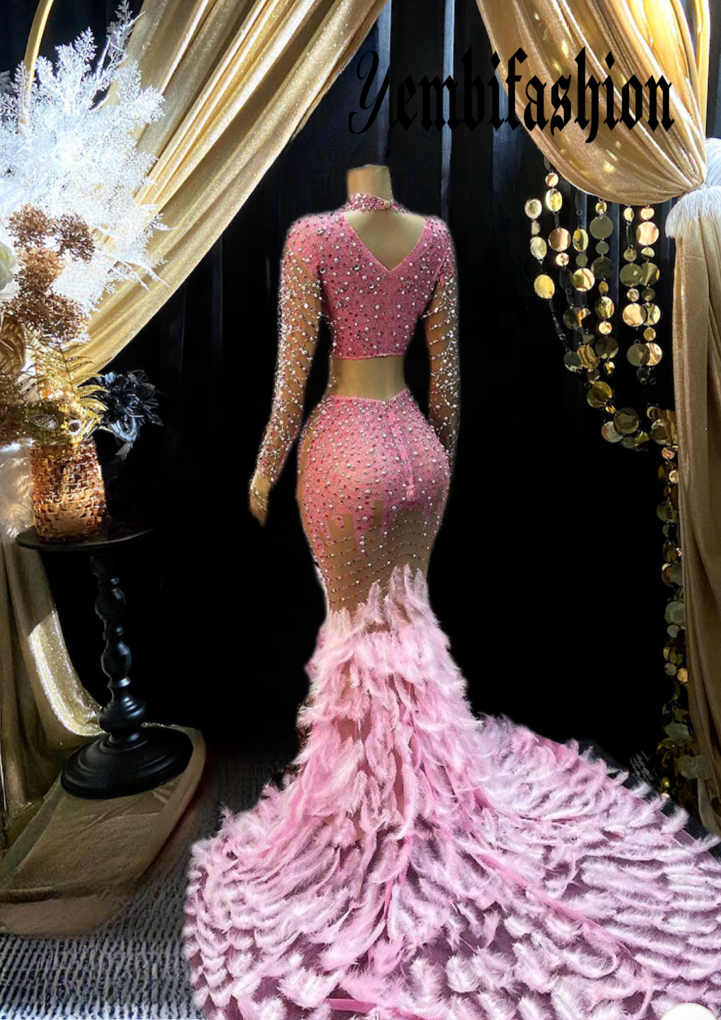 A stunning pink feather set cocktail dress with elegant feather detailing, perfect for formal events and parties.