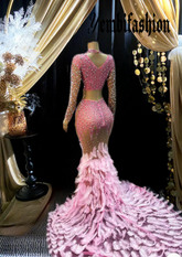 A stunning pink feather set cocktail dress with elegant feather detailing, perfect for formal events and parties.