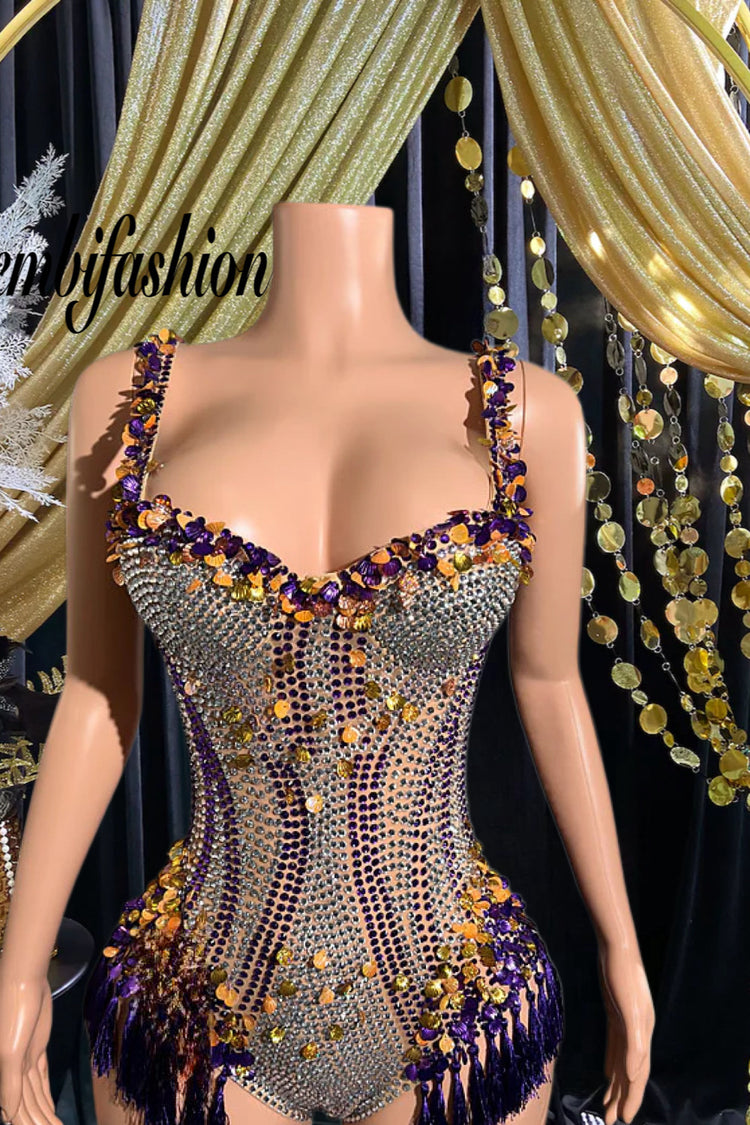Close-up of a glamorous rhinestone tassel bodysuit with intricate detailing and flowing tassels, perfect for a stylish night out.