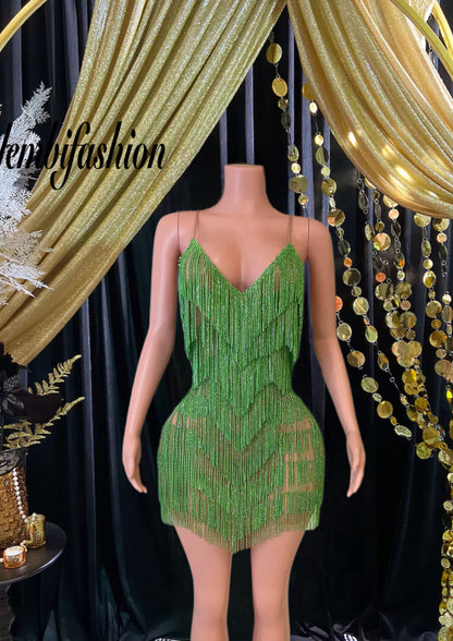 A stunning Vera Mini Tassel Dress with rhinestones and tassel accents, designed for elegance and glamour.