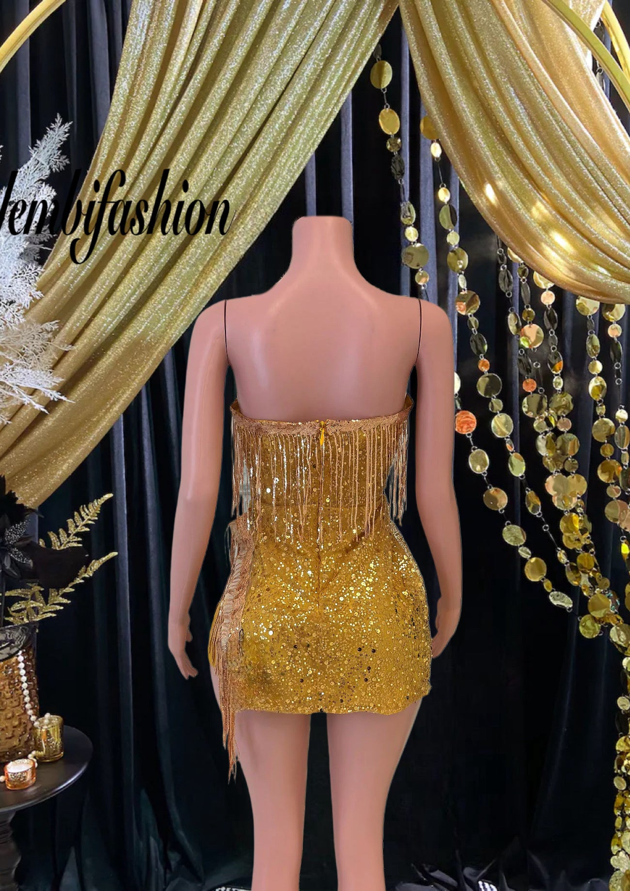 A shimmering mini dress covered in sequins, ideal for parties and special occasions, available online.