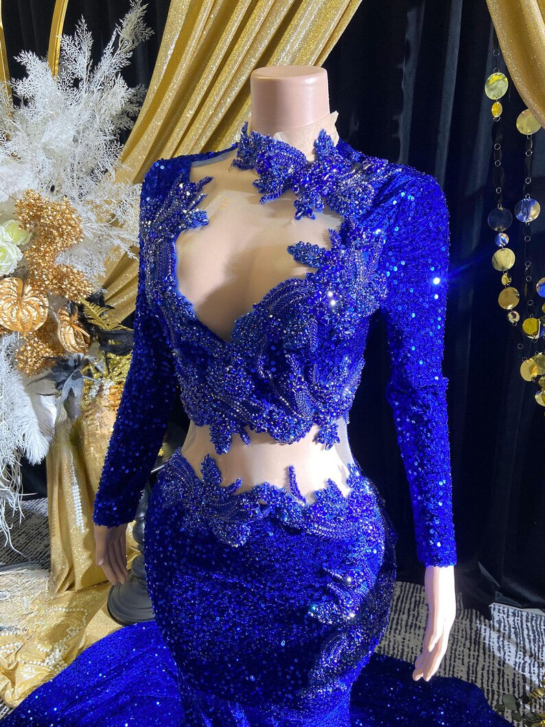 Royal blue evening dress with intricate rhinestone detailing and sparkling crystal embellishments.

Let me know if you'd like any adjustments!