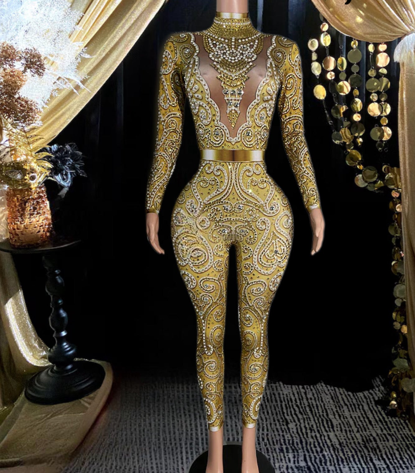 A fashionable gold rhinestone bodysuit with sparkling details, tailored for a flattering, stylish fit