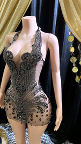 Appliqué mini dress with black rhinestones, featuring intricate detailing and perfect for parties or formal events