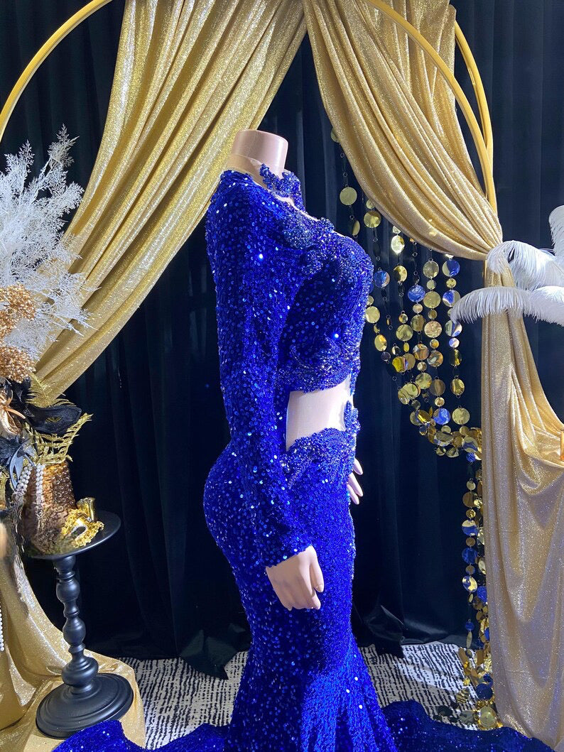 Royal blue evening dress with intricate rhinestone detailing and sparkling crystal embellishments.

Let me know if you'd like any adjustments!