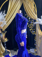 Royal blue evening dress with intricate rhinestone detailing and sparkling crystal embellishments.

Let me know if you&