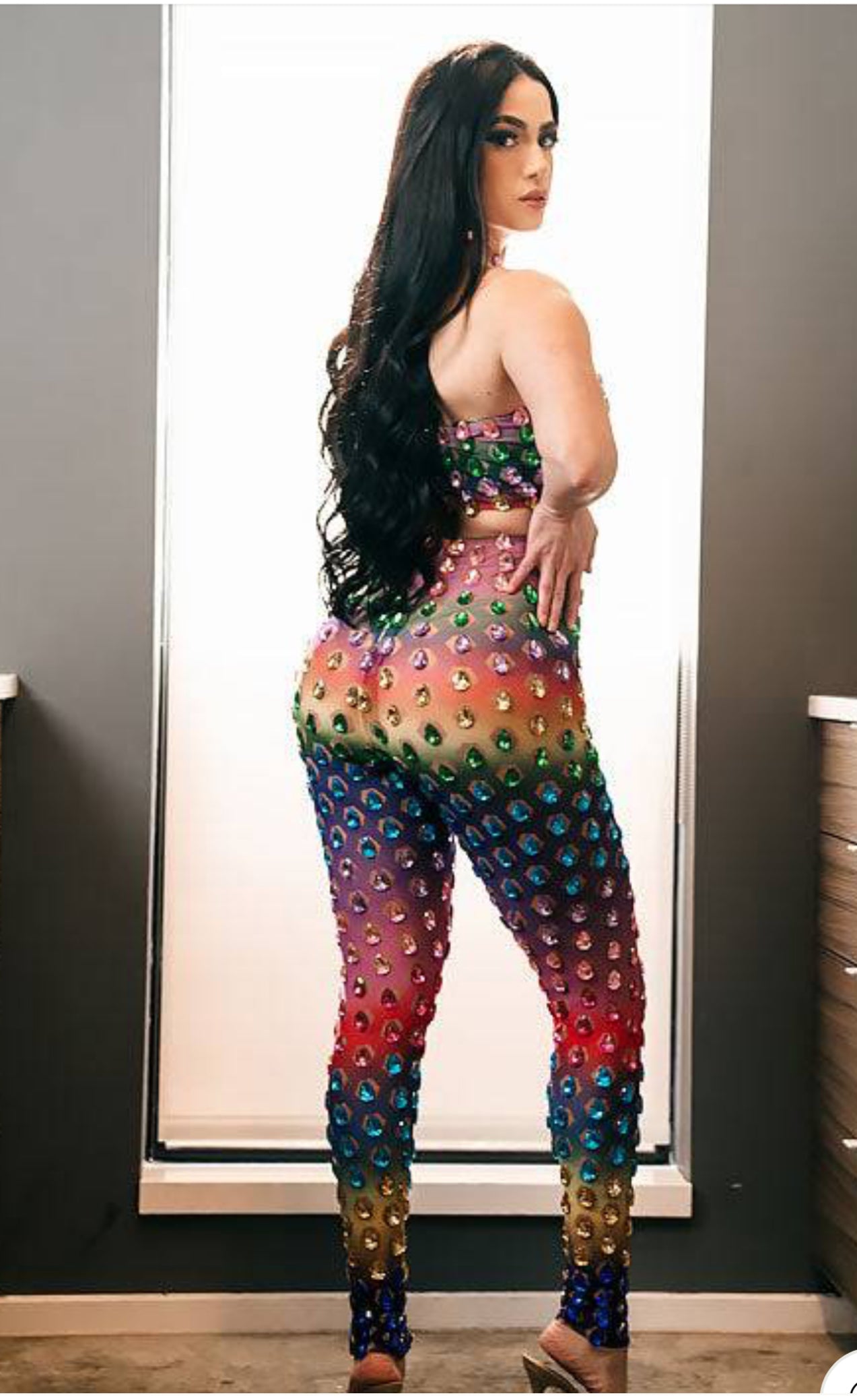 A vibrant rainbow set party dress with colorful patterns, perfect for festive occasions and celebrations.