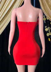 A red mini diamante dress with feather details, perfect for a glamorous evening or party