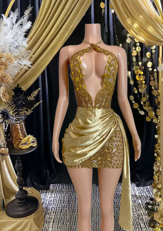 A trendy rhinestone denim mini dress featuring sparkling rhinestone straps, with a flattering fitted silhouette that combines edgy denim and glamorous accents. Perfect for both casual and evening wear