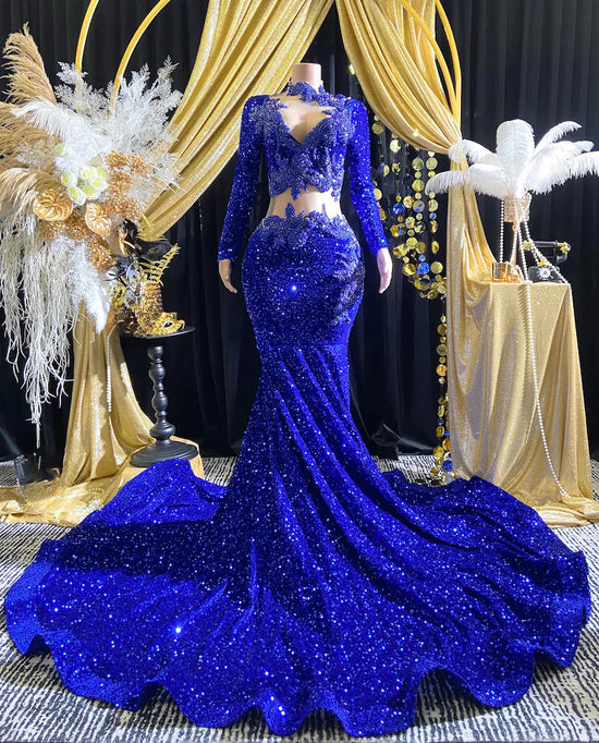 Royal blue evening dress with intricate rhinestone detailing and sparkling crystal embellishments.

Let me know if you&