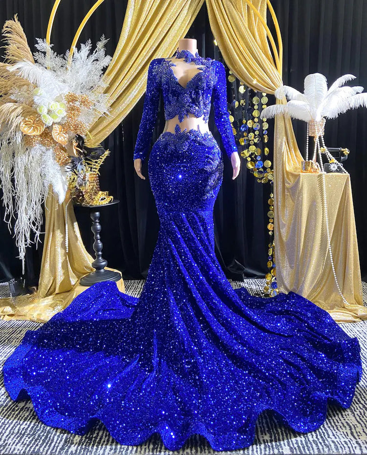 Royal blue evening dress with intricate rhinestone detailing and sparkling crystal embellishments.

Let me know if you&