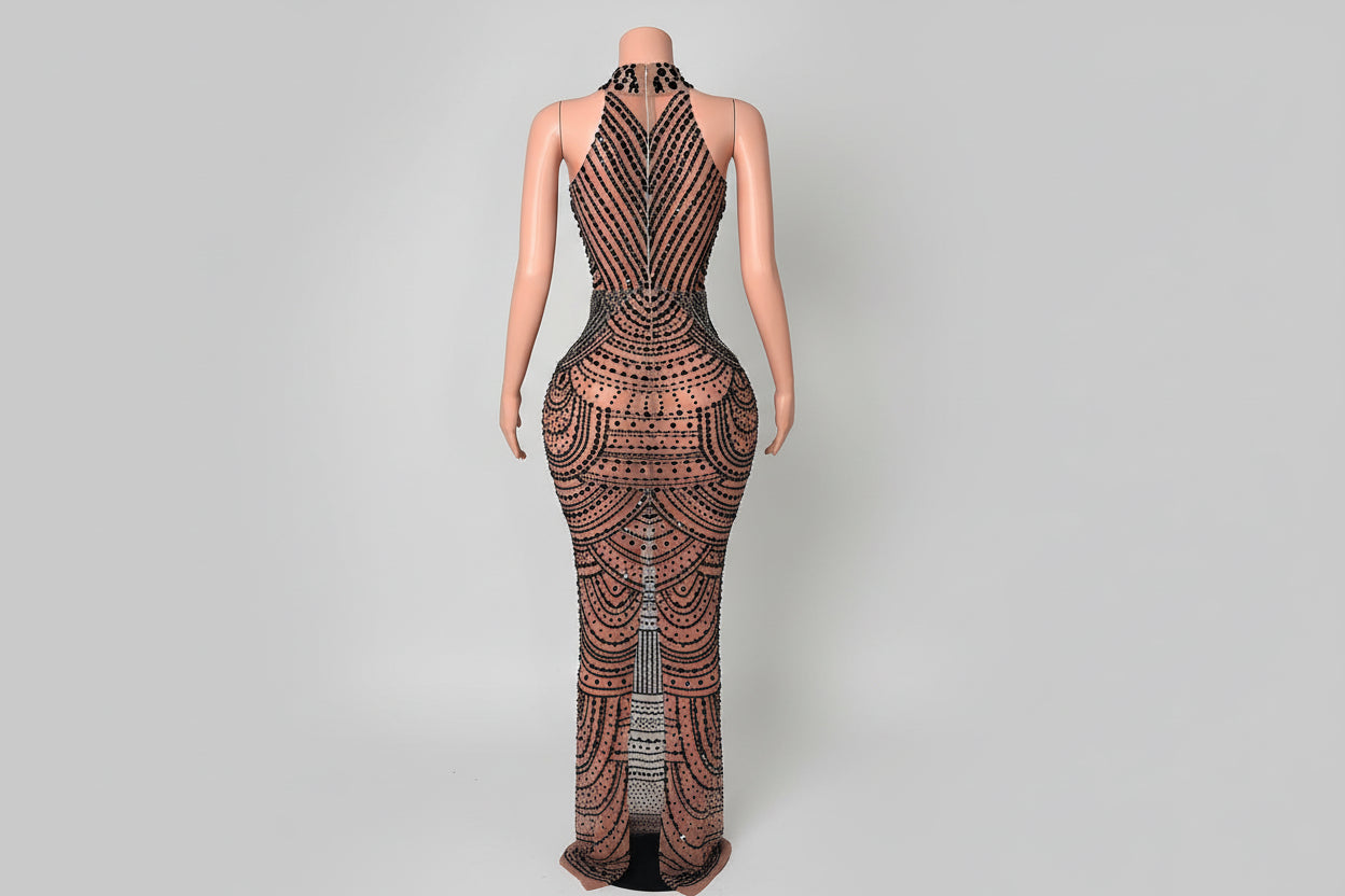 Patterned dress on a mannequin in a room with decorative elements.
