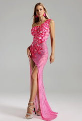 Woman wearing a Prisca rhinestone pink formal evening dress at a formal event, highlighting the rhinestone details and elegant silhouette.