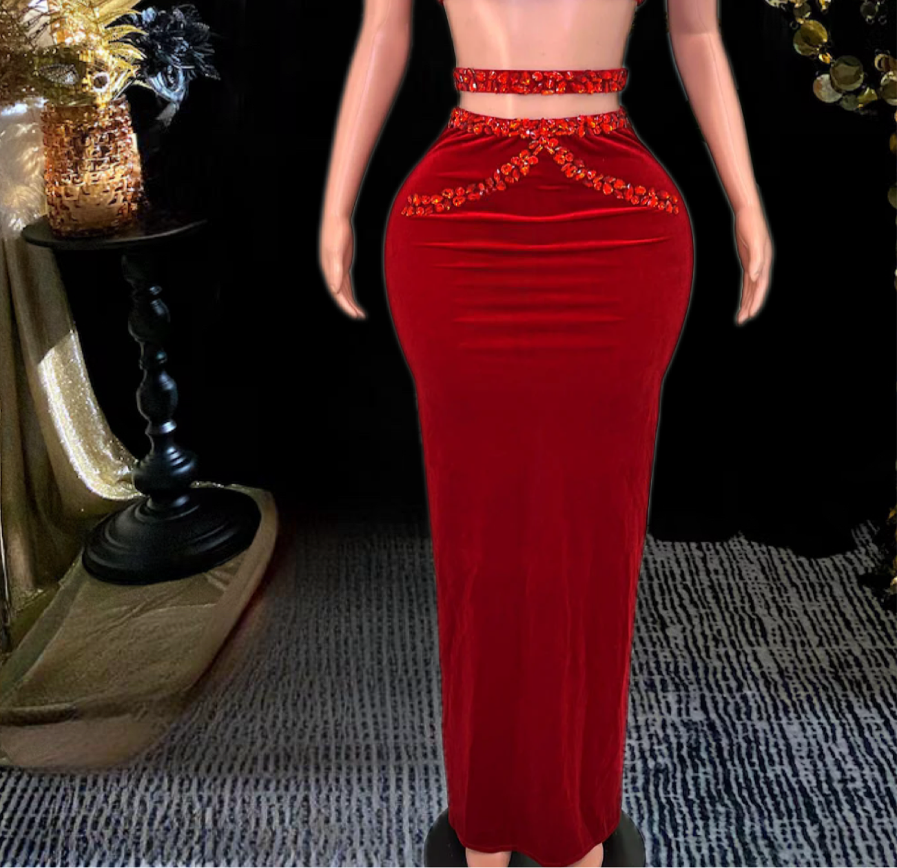 A stylish red skirt set featuring rhinestone detailing, perfect for glamorous occasions.