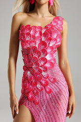 Woman wearing a Prisca rhinestone pink formal evening dress at a formal event, highlighting the rhinestone details and elegant silhouette.