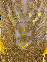 A vibrant yellow mini dress adorned with feathers and rhinestones, perfect for glamorous events and parties.