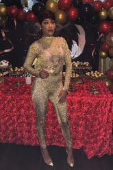 A fashionable gold rhinestone bodysuit with sparkling details, tailored for a flattering, stylish fit