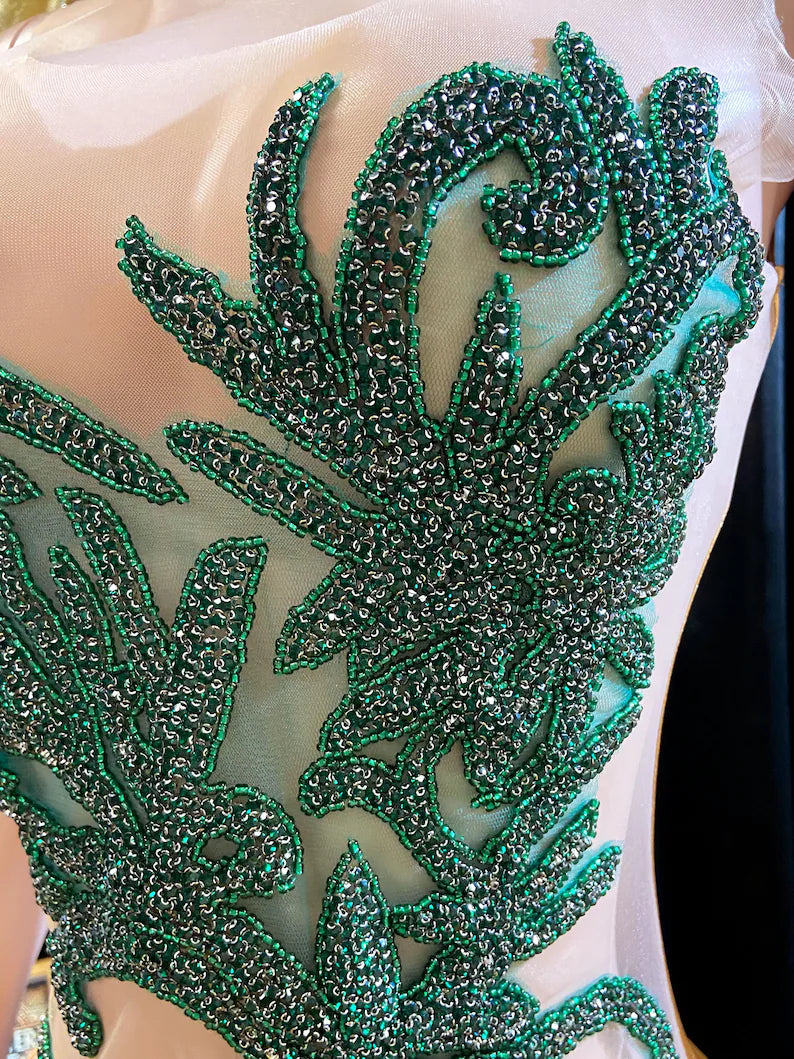 Formal wedding guest dress with rhinestone embellishments, featuring a stunning long design