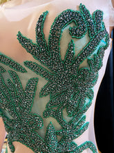 Formal wedding guest dress with rhinestone embellishments, featuring a stunning long design