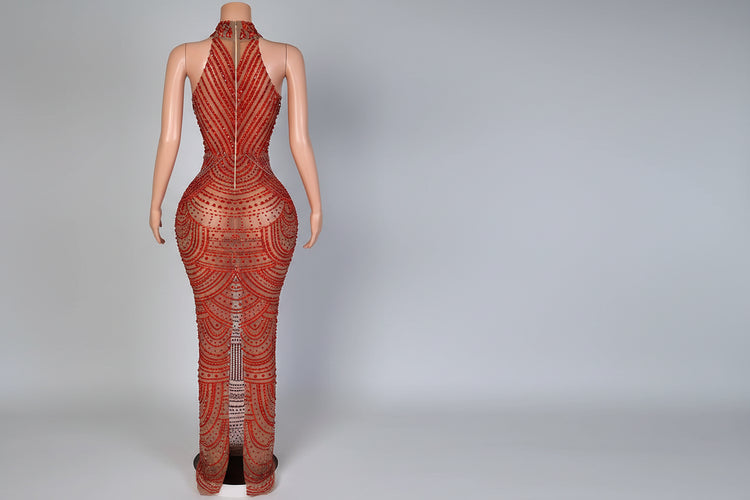 Mannequin wearing a red patterned outfit with a blurred background