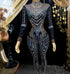 A stylish long sleeve diamante bodysuit showcasing elegant detailing and a flattering fit.