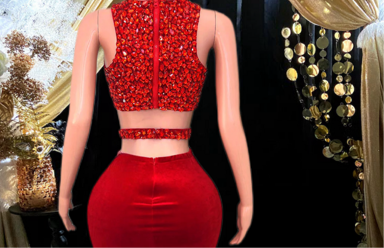 A stylish red skirt set featuring rhinestone detailing, perfect for glamorous occasions.