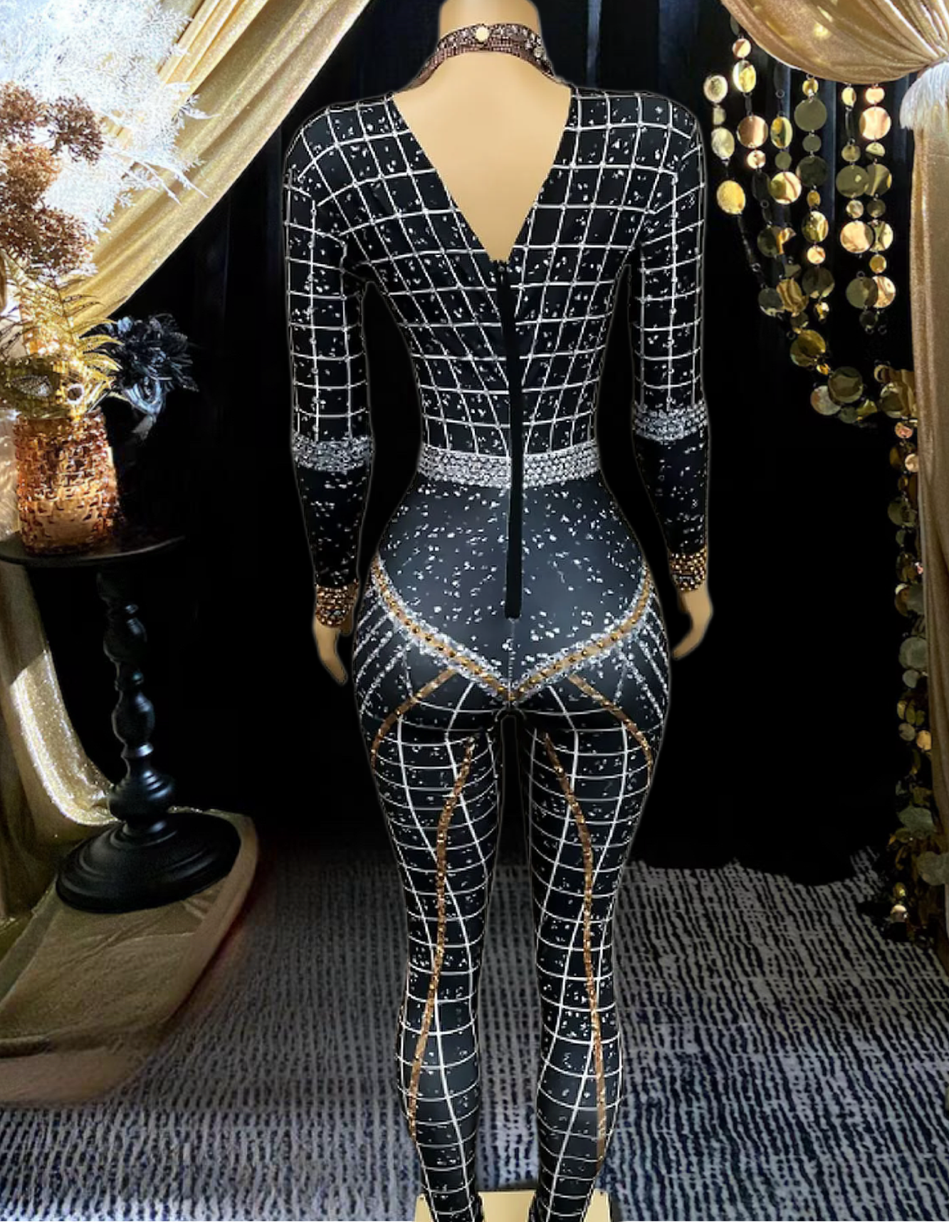 A stylish long sleeve diamante bodysuit showcasing elegant detailing and a flattering fit.