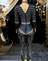 A stylish long sleeve diamante bodysuit showcasing elegant detailing and a flattering fit.