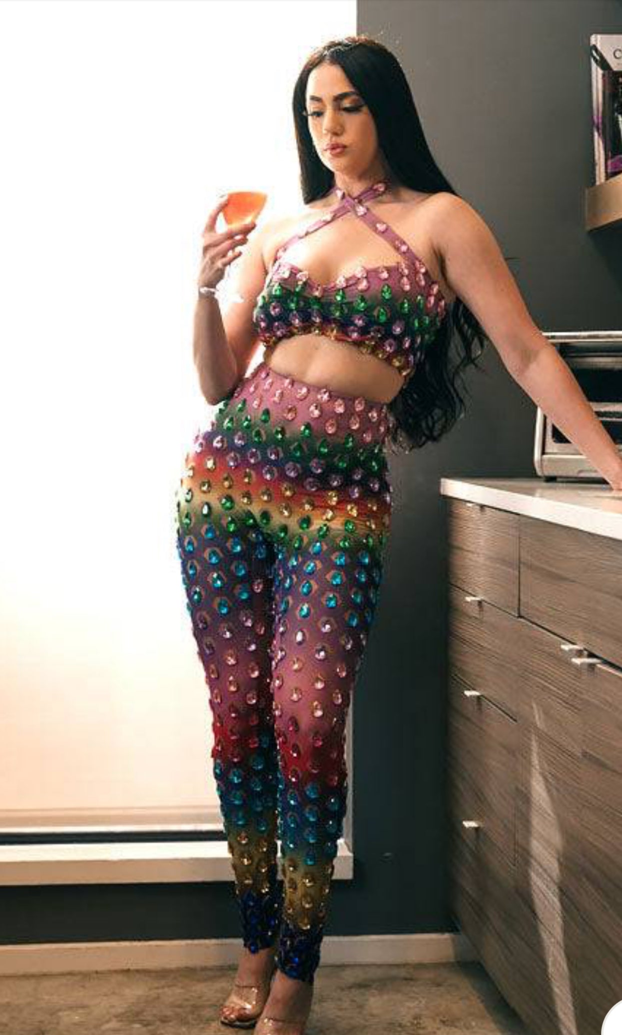 A vibrant rainbow set party dress with colorful patterns, perfect for festive occasions and celebrations.