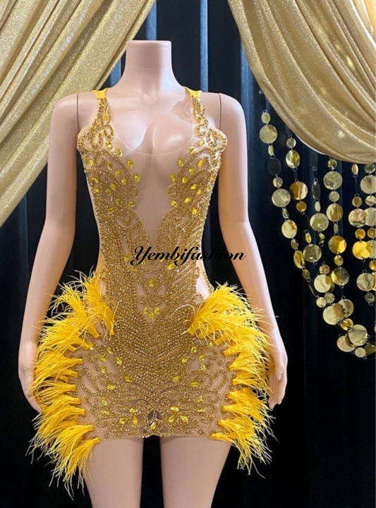 A vibrant yellow mini dress adorned with feathers and rhinestones, perfect for glamorous events and parties.