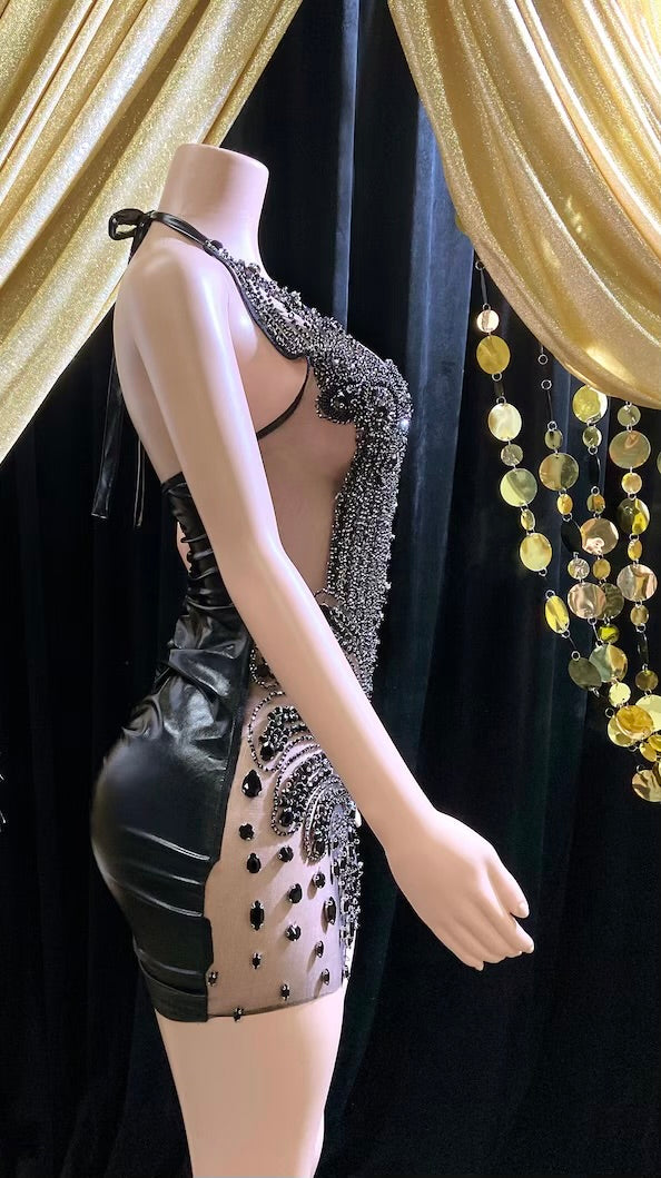 Appliqué mini dress with black rhinestones, featuring intricate detailing and perfect for parties or formal events