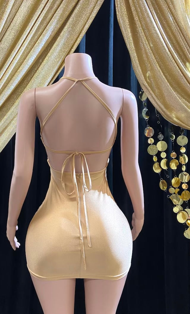 Front view of a gold rhinestone A-line mini dress with sparkling rhinestones and an elegant fit.