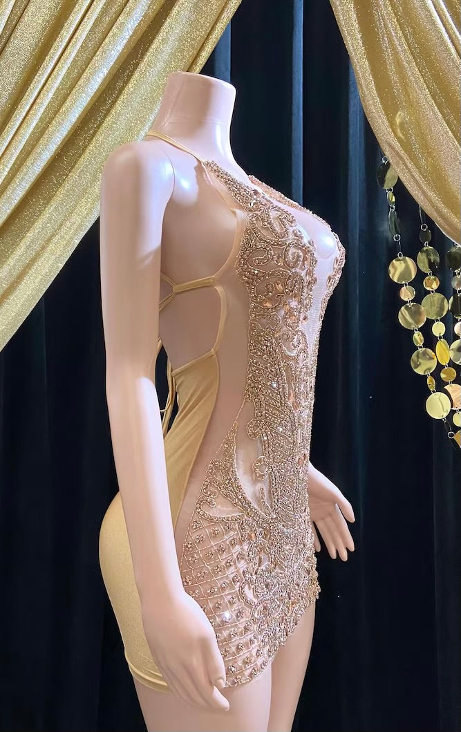 Front view of a gold rhinestone A-line mini dress with sparkling rhinestones and an elegant fit.